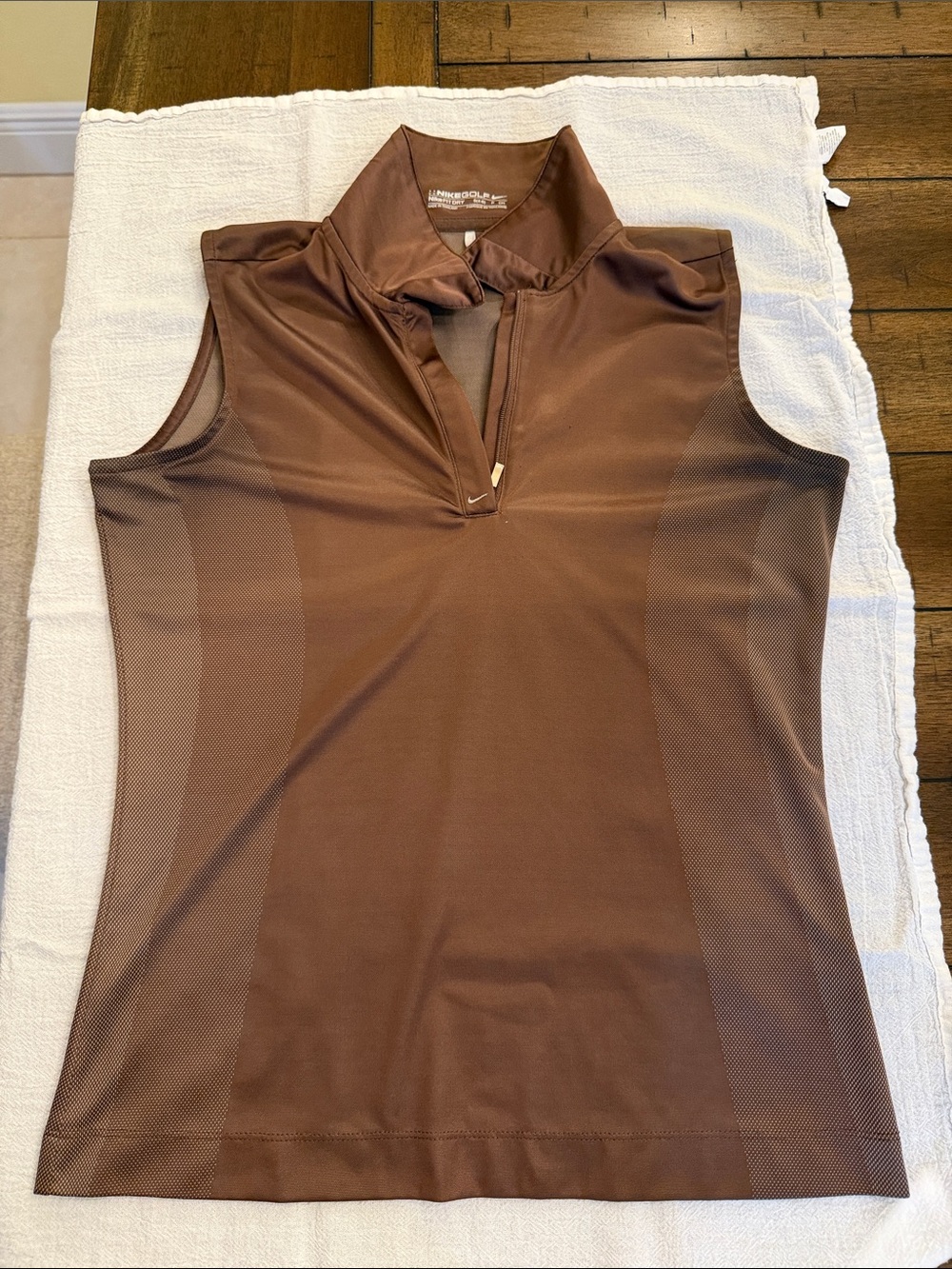 Nike Golf Dri-FIT half-zip top featuring a mock collar.